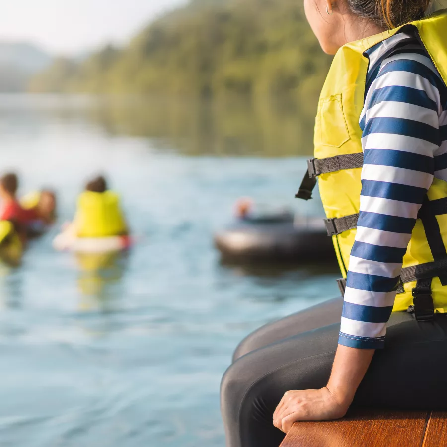 Adult on jetty with lifejacket