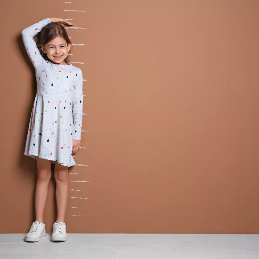 Child measuring their height